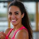Client Emily Rodriguez celebrating a fitness milestone.